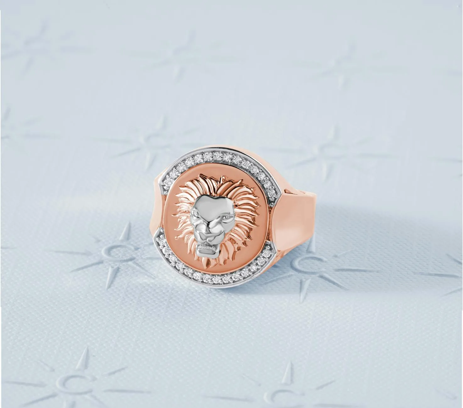 Lion head ring with diamonds in rose gold, showcasing luxurious design and artistry.